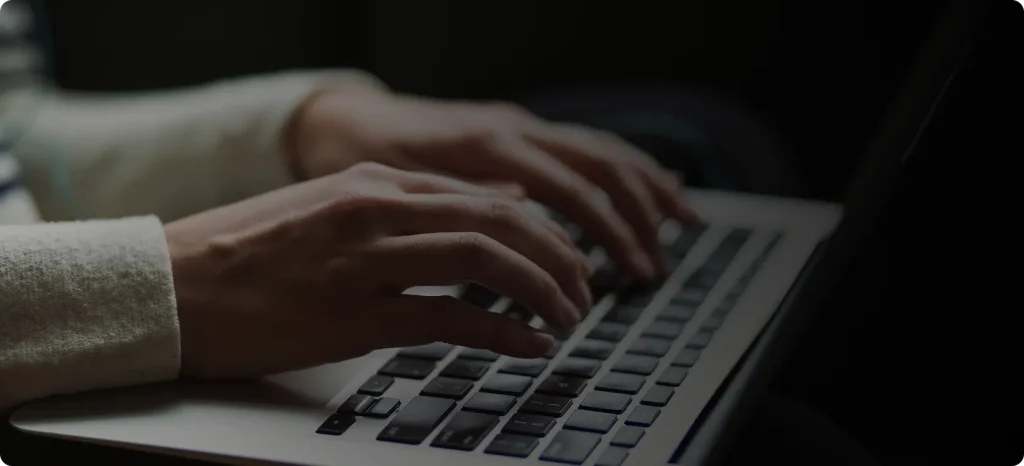 A person using a laptop,