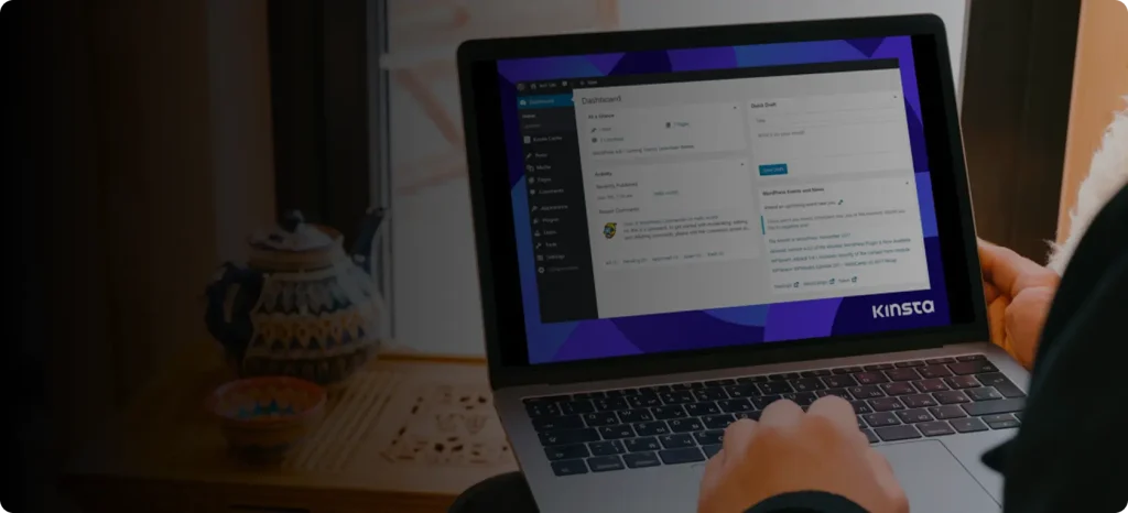 A user operating a laptop featuring WordPress